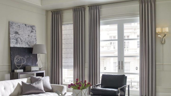 Hunter Douglas Design Studio™ Roman Shades installed on a door and window