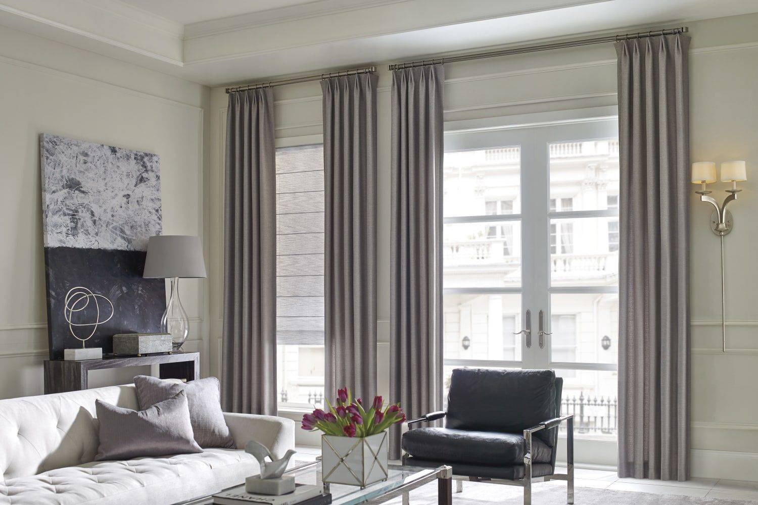 Hunter Douglas Design Studio™ Roman Shades installed on a door and window