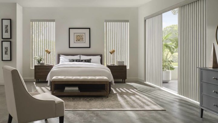 Cadence® Vertical Blinds covering large windows in a bedroom near Galena, IL & Dubuque, IA
