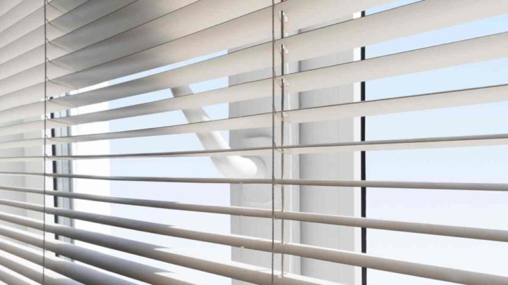 White window blinds covering a patio door at Vignettes Home near Galena, IL, and Dubuque, IA