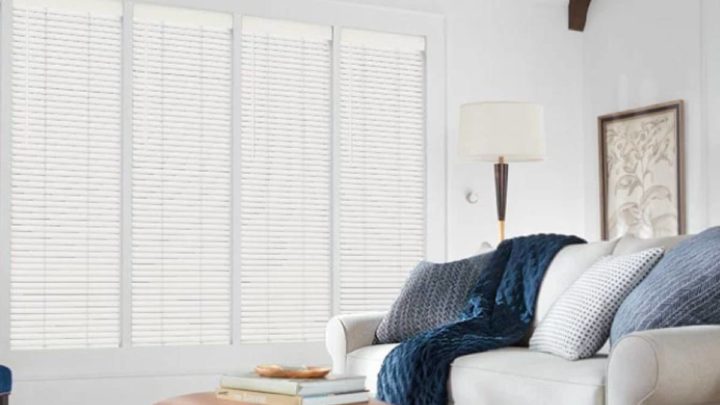 Hunter Douglas automatic blinds blocking light in a contemporary living room at Vignettes Home near Galena, IL, and Dubuque, IA