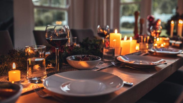 Wood dining table with holiday decor and accessories before a dinner near Galena, IL & Dubuque, IA