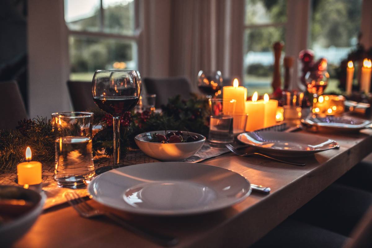 Wood dining table with holiday decor and accessories before a dinner near Galena, IL & Dubuque, IA