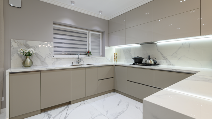 Grey kitchen shades in luxe light gray kitchen with marble countertops.